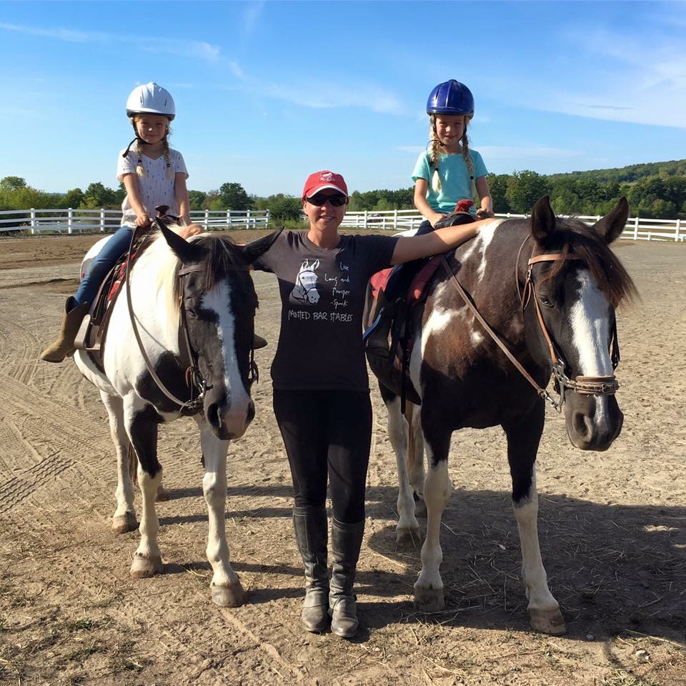 Jen and Young Riding Students